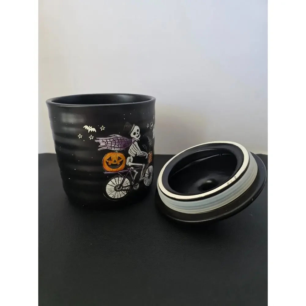 Cobwebs & Cauldrons Skeleton on Bike with Jack-O-Lantern 5 1/2
